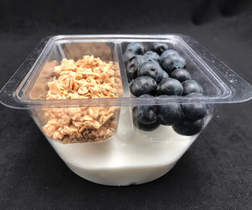 Plastic meal tray holding parfait ingredients